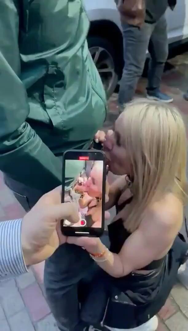 Blonde whore sucks cock on the front of the club without a condom for money