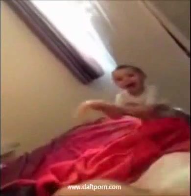 Little kid plays with mom's dildo