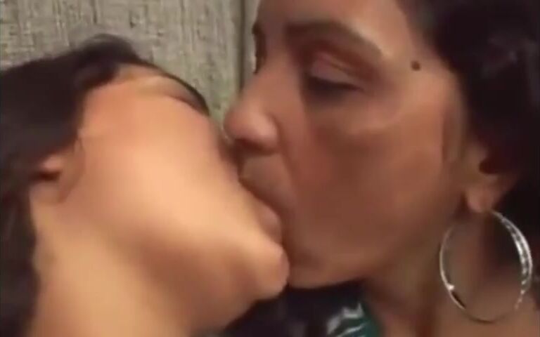 Chubby Latina mom and daughter are kissing on camera